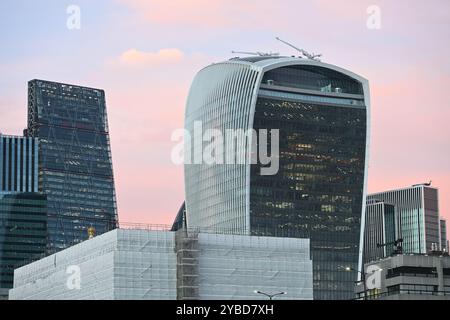 The leaden hall building and 20 Fenchurch Street located in the City of London in the evening with a red sky Stock Photo