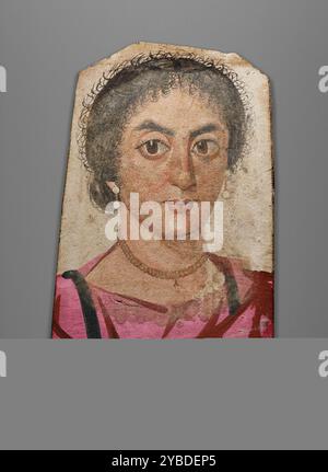Mummy Portrait of a Young Woman, about A.D. 170-200.  Additional Info: A Romano-Egyptian funerary portrait of a woman painted in tempera (pigments suspended in animal glue) on a native Egyptian sycamore fig panel. A gray under layer is visible at the edges and bottom of the panel. The features, dominated by large heavy-lidded eyes, are composed with a range of finely applied linear brushstrokes varying in thickness from the eyebrows to the eyelashes to a variety of highlights on the cheeks, nose and chin. Stock Photo