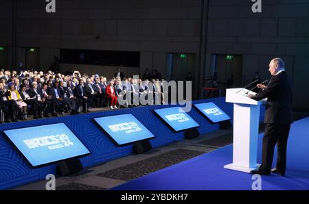 Moscow, Russia. 18th Oct, 2024. Russian President Vladimir Putin, delivers remarks during a plenary session of the BRICS Business Forum at the International Trade Centre, October 18, 2024 in Moscow, Russia. Credit: Mikhail Metzel/Kremlin Pool/Alamy Live News Stock Photo