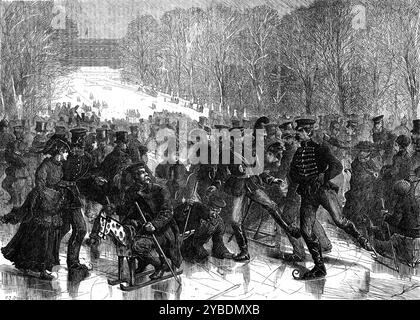 Christmas-Day Sports at Versailles, [France], 1871. 'On Christmas Day the ice was so thick and strong upon all the waters in the neighbourhood of Paris, that it would have borne artillery. In the park of Versailles the great ponds were covered with crowds of skaters - many Prussians, a few Americans and Englishmen, and a very few Frenchmen. Some of the figures that glided about, more or less gracefully, upon the burnished bosom of the lake, were quaintly out of keeping with preconceived notions respecting skating costume. It was strange to see upon the ice a gigantic officer of cuirassiers, 6 Stock Photo