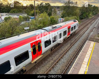 Pontyclun, Wales - 1 October 2024: Transport for Wales Class 197 diesel commuter train stopped at the village station of Pontyclun Stock Photo