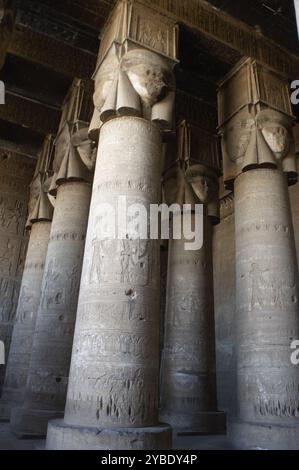 Hathor Temple, Dendera, Egypt, 2003. Hypostyle hall with Hathoric columns - ie columns with the head of the goddess Hathor as the capital. The existing temple's structure began construction in 54 BC, the late Ptolemaic period. Stock Photo