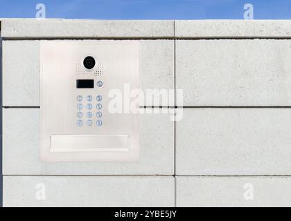 Security keypad and camera on concrete wall Stock Photo