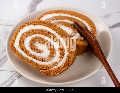Pumpkin Swiss Roll being served Stock Photo