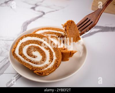 Pumpkin Swiss Roll being served Stock Photo