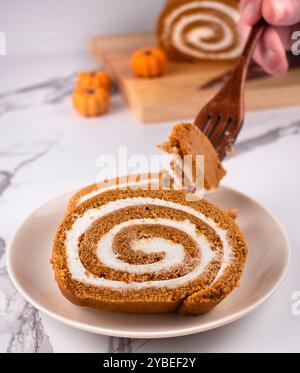 Pumpkin Swiss Roll being served Stock Photo