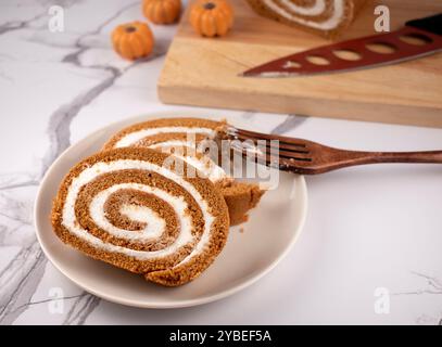 Pumpkin Swiss Roll being served Stock Photo