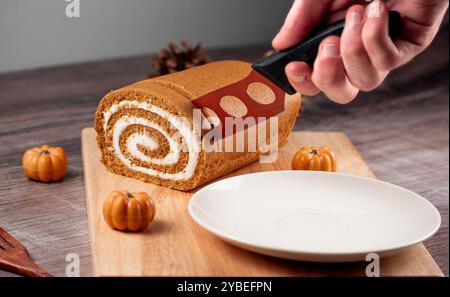 Pumpkin Swiss Roll being served Stock Photo