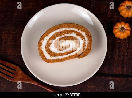 Pumpkin Swiss Roll being served Stock Photo