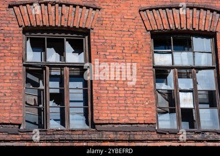 industrial background, windows of abandoned vintage factory building Stock Photo