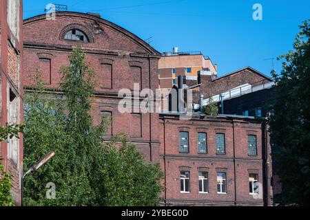industrial background, vintage buildings of old factory workshops made of red brick Stock Photo