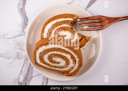 Pumpkin Swiss Roll being served Stock Photo