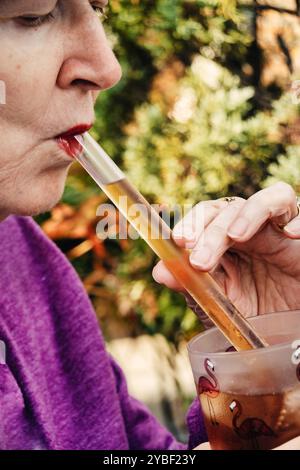Person using an Eco-friendly glass straw product from California Straw Movement, 2024, United States Stock Photo