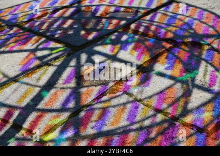 Vibrant Multicolored Shadows and Reflections on Urban Pavement. High quality photo Stock Photo