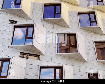 Geometric Building Facade with Reflective Windows and Unique Architecture. High quality photo Stock Photo