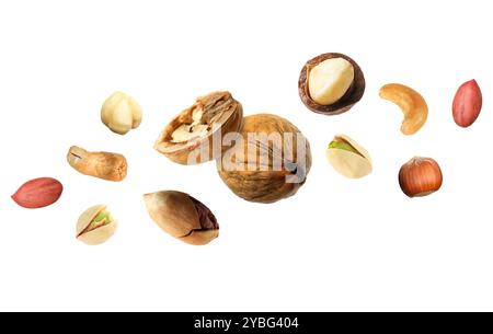 Macadamia and other nuts in air on white background Stock Photo