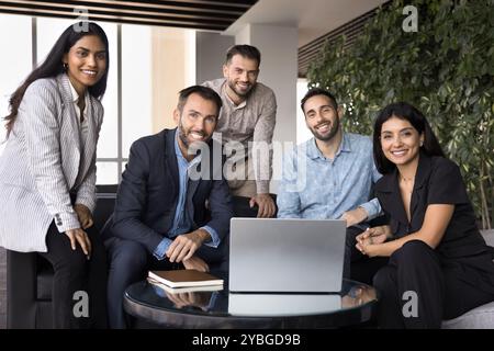 Diverse team of happy business colleagues posing for portrait Stock Photo