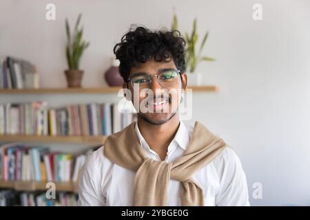 Happy young Indian college student guy looking at camera Stock Photo