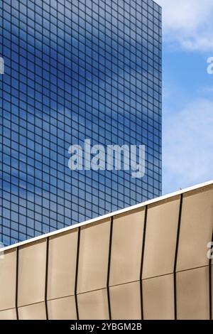 Blue glass skyscraper with a contrasting golden facade, in Rotterdam, South Holland, Netherlands Stock Photo