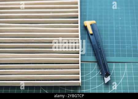 Wood and cutter set for making architecture models on working table. Top view Stock Photo