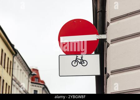 No entry sign for vehicular traffic except bicycles. Road sign against old Europe cityscape. With copy space. Concept environment Stock Photo