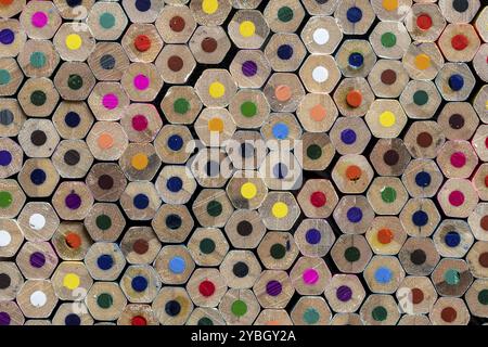 Backside of stacked colored pencils as a background photo Stock Photo