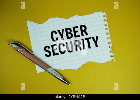 Cyber Security text written on paper torn top view on yellow background Stock Photo