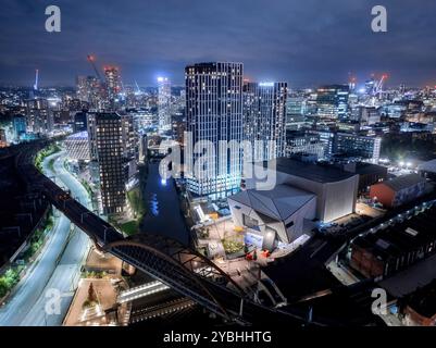 Castlefield and Manchester city centre from above at night, showing illuminated buildings and the urban skyline of Greater Manchester, England. Stock Photo
