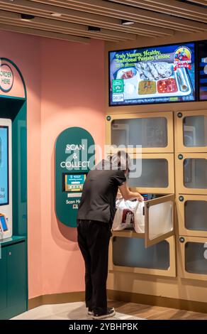 Bistro Bytes ready-to-eat food court store with boxes where a shopper picks the food order up - scan and collect technology. Singapore Stock Photo