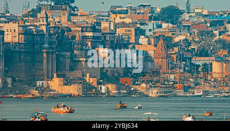 Varanasi, India. View On Boats Floating Near Rana Mahal Ghat, Darbhanga Ghat And Dashashwamedh Ghat In Early Morning. Many Hindu Temples. Sacred Stock Photo