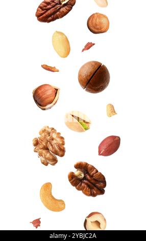 Macadamia and other nuts in air on white background Stock Photo