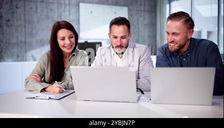 Busy Business People With Laptop. Meet Colleagues In Office Stock Photo