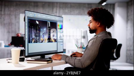 African Graphic Web Designer Using Design Editing Software Stock Photo