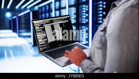 Cloud Computer Engineer Coding In Server Room In Data Center. Configuring AI Technology Stock Photo