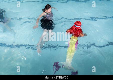 Johannesburg, South Africa. 19th Oct, 2024. Participants are seen during a mermaid competition in Johannesburg, South Africa, Oct. 19, 2024. The annual event gives participants a chance to showcase their mermaid skills and creativity. Credit: Shiraaz Mohamed/Xinhua/Alamy Live News Stock Photo