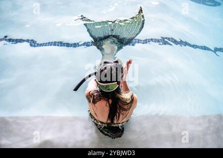 Johannesburg, South Africa. 19th Oct, 2024. A participant is seen during a mermaid competition in Johannesburg, South Africa, Oct. 19, 2024. The annual event gives participants a chance to showcase their mermaid skills and creativity. Credit: Shiraaz Mohamed/Xinhua/Alamy Live News Stock Photo