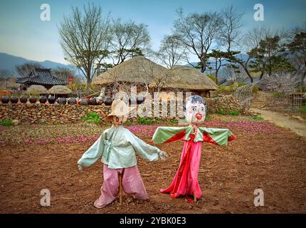 Scarecrow wearing hanbok in Naganeupseong village, located in Nagan-myeon, Suncheon, Jeollanam-do Province, South Korea. Stock Photo