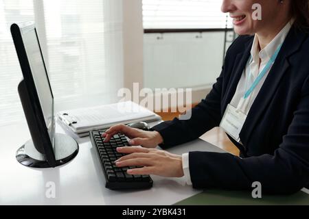 Businesswoman Working On Computer In Office Stock Photo