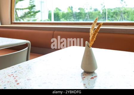 Decorative vase on the table with natural sun light Stock Photo