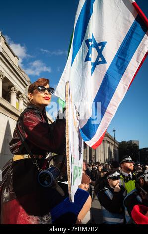 London, UK, October 19th. Elaaheh Jamali, aka LilyMoo, an Iranian leads a counter protest against the Pro Palestine, Hamas and Hezbollah rally in Trafalgar Square London.  (Tennessee Jones - Alamy Live News) Stock Photo