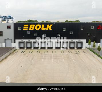 ALMELO, NETHERLANDS - OCTOBER 12, 2024: Aerial view of a new warehouse with several loading docks in front Stock Photo