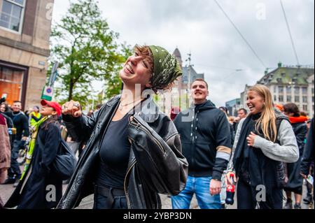 Amsterdam, Netherlands. 19th Oct, 2024. A woman is seen happily dancing during the parade. ADEV (Amsterdam Danst Ergens Voor), which means 'Amsterdam Dances For A Cause' organized for the 12th time, its an annual demonstration for squatting, free spaces, and affordable housing in the city (Photo by Ana Fernandez/SOPA Images/Sipa USA) Credit: Sipa USA/Alamy Live News Stock Photo