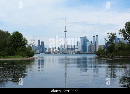 Toronto, ON, Canada - June 13th 2024: View across Lake Ontario from the Toronto Islands of the Toronto skyline including the CN Tower in the centre. Stock Photo