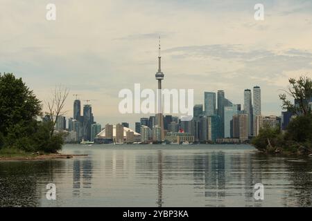 Toronto, ON, Canada - June 13th 2024: View across Lake Ontario from the Toronto Islands of the Toronto skyline including the CN Tower in the centre. Stock Photo