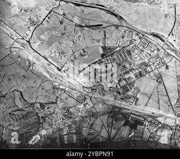 An aerial reconnaissance photograph of Auschwitz I showing the prisoners' barracks and administrative buildings which are visible along with the main railway lines. Stock Photo