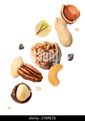 Macadamia and other nuts in air on white background Stock Photo