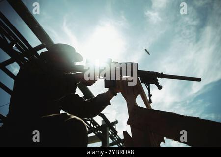 A U.S. Marine assigned to Reconnaissance Company, 15th Marine Expeditionary Unit, fires an M110 Semi-Automatic Sniper System during a live-fire range with Republic of Korea Marines, and Philippine Marines and coast guardsmen as part of exercise KAMANDAG 8 at Marine Base Gregorio Lim, Ternate, Philippines, Oct. 18, 2024. KAMANDAG is an annual Philippine Marine Corps and U.S. Marine Corps-led exercise aimed at enhancing the Armed Forces of the Philippines’ defense and humanitarian capabilities by providing valuable training in combined operations with foreign militaries in the advancement of a F Stock Photo