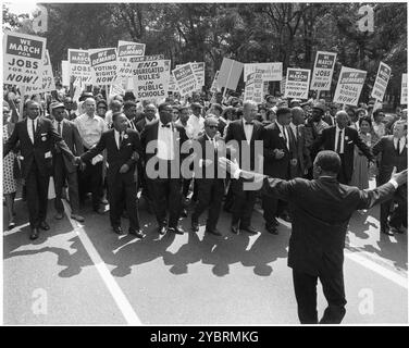 Photograph of Leaders at the Head of the Civil Dr. Martin Luther King, Jr., front row, second from  right, and other civil rights leaders march on Constitution Avenue in Washington, DC, August 28, 1963. (National Archives and Records Administration (NARA) / United States Information Agency photo) Stock Photo