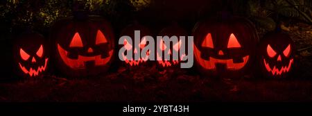 Jack-o-lanterns glowing in the dark in Halloween. Stock Photo