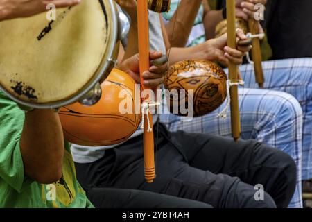 Afro Brazilian percussion musical instruments during a capoeira performance in the streets of Brazil Stock Photo